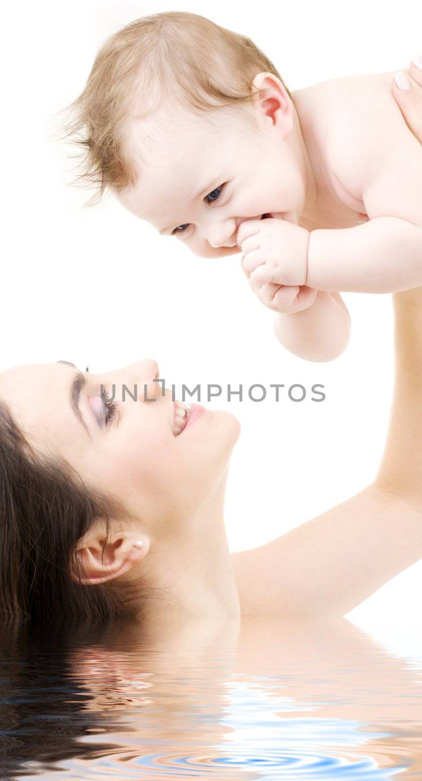 picture of happy mother with baby in water (focus on baby)