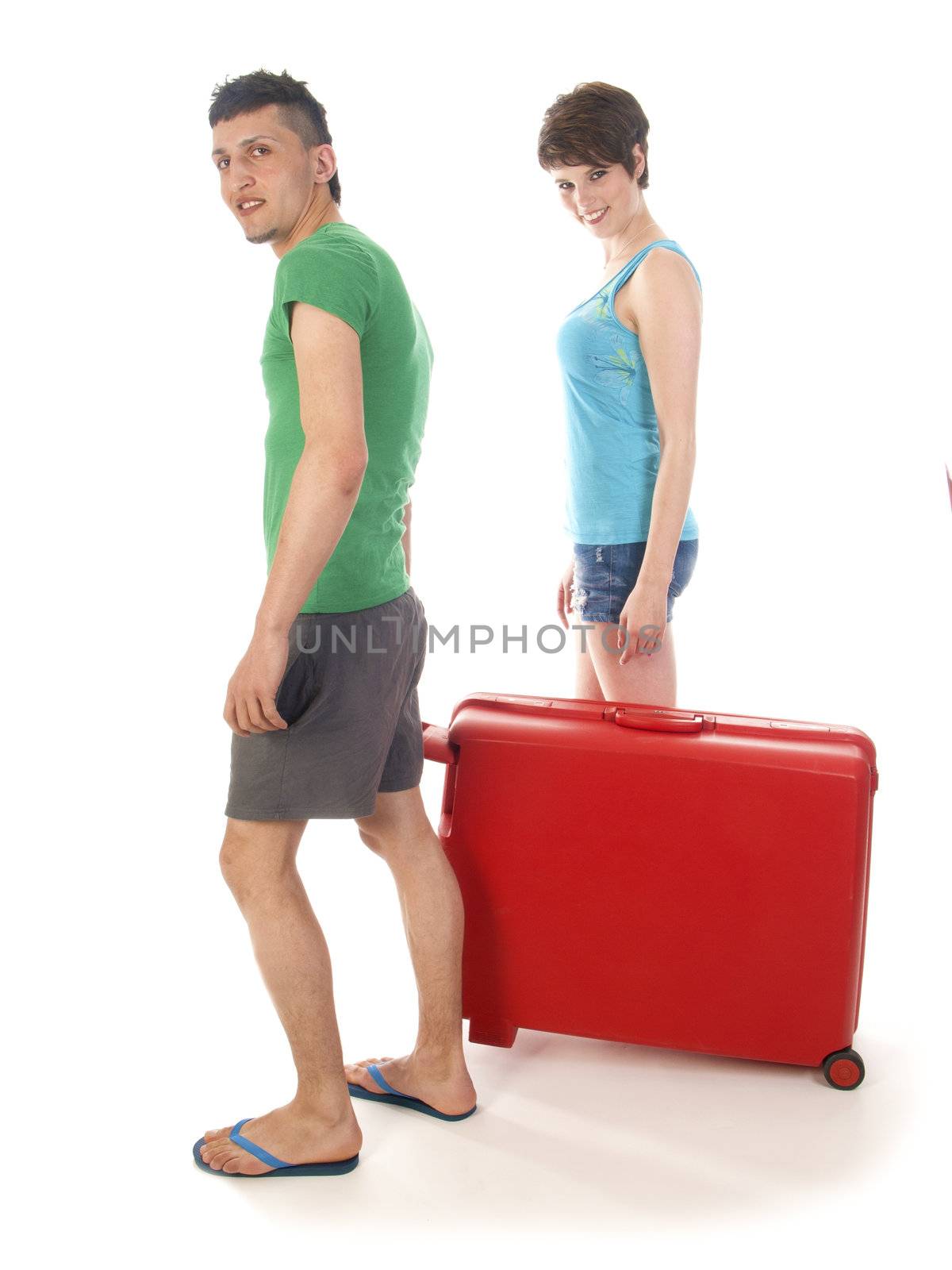 young couple going on vacation with suitcase on a passenger plane by kees59