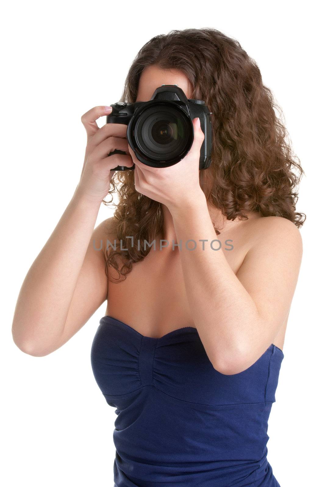 Woman holding an SLR camera, getting ready to take a picture, isolated in white