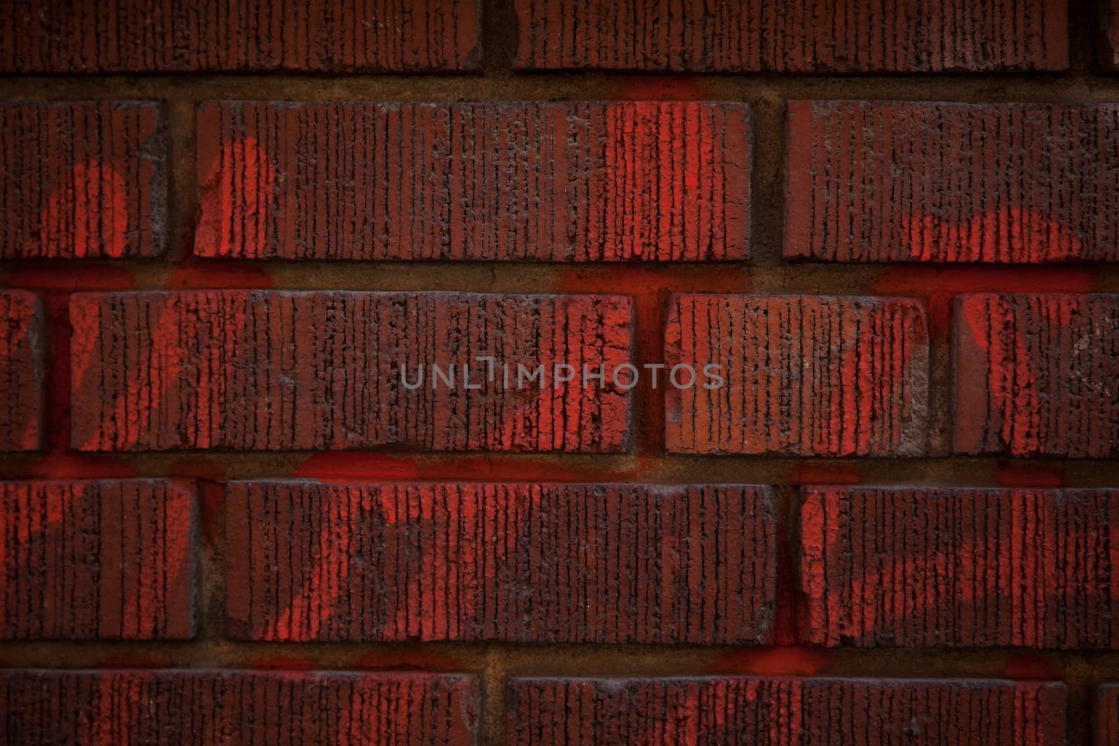 Red brick wall with writing