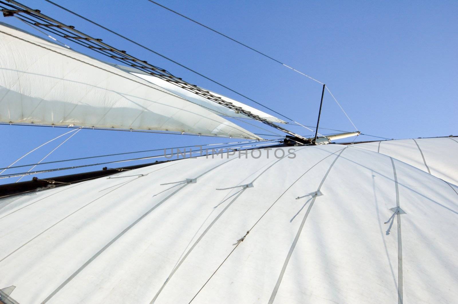 Big sail on blue sky background