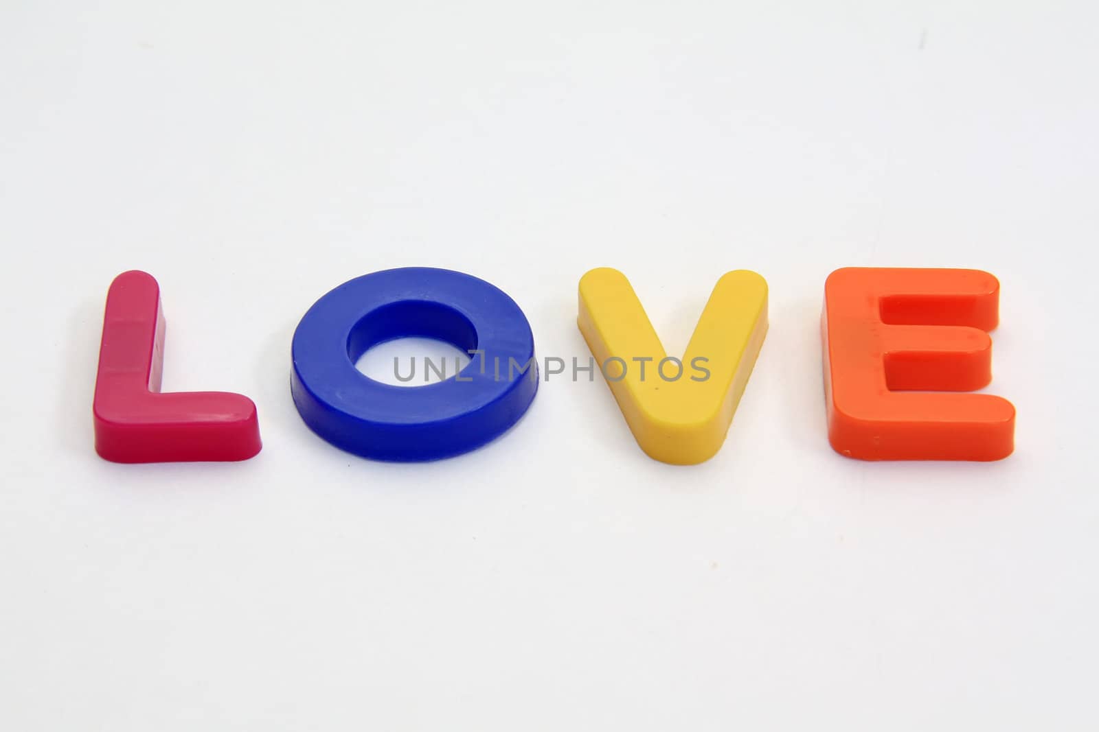 Word LOVE made from Plastic isolated over white background