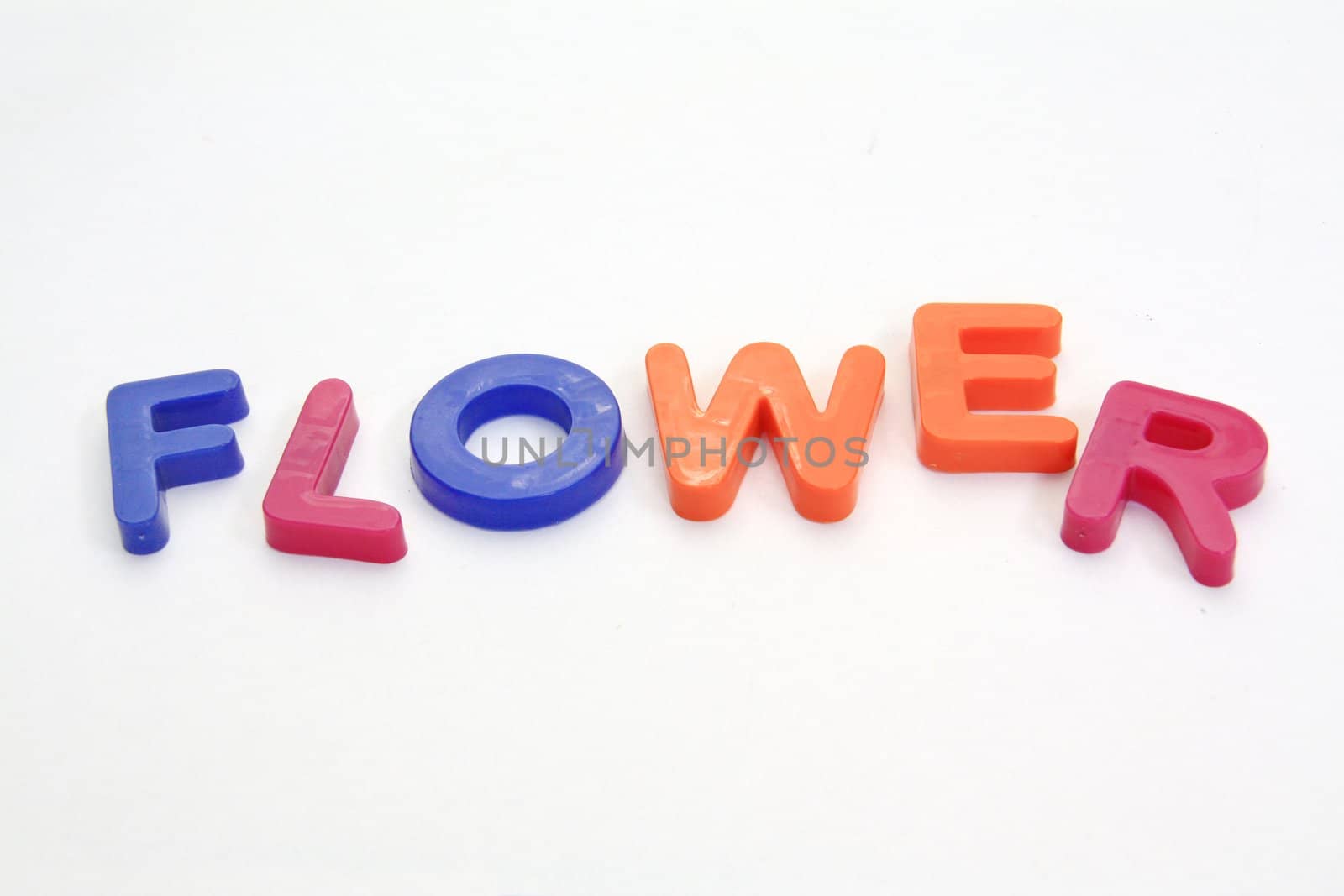 Colorful alphabet blocks. FLOWERS over white background