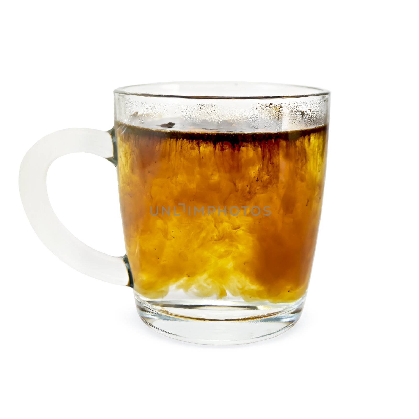 Granulated coffee in a glass mug with hot water isolated on white background