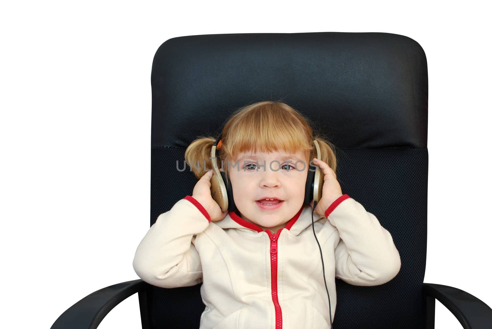 Little girl with headphones listen music