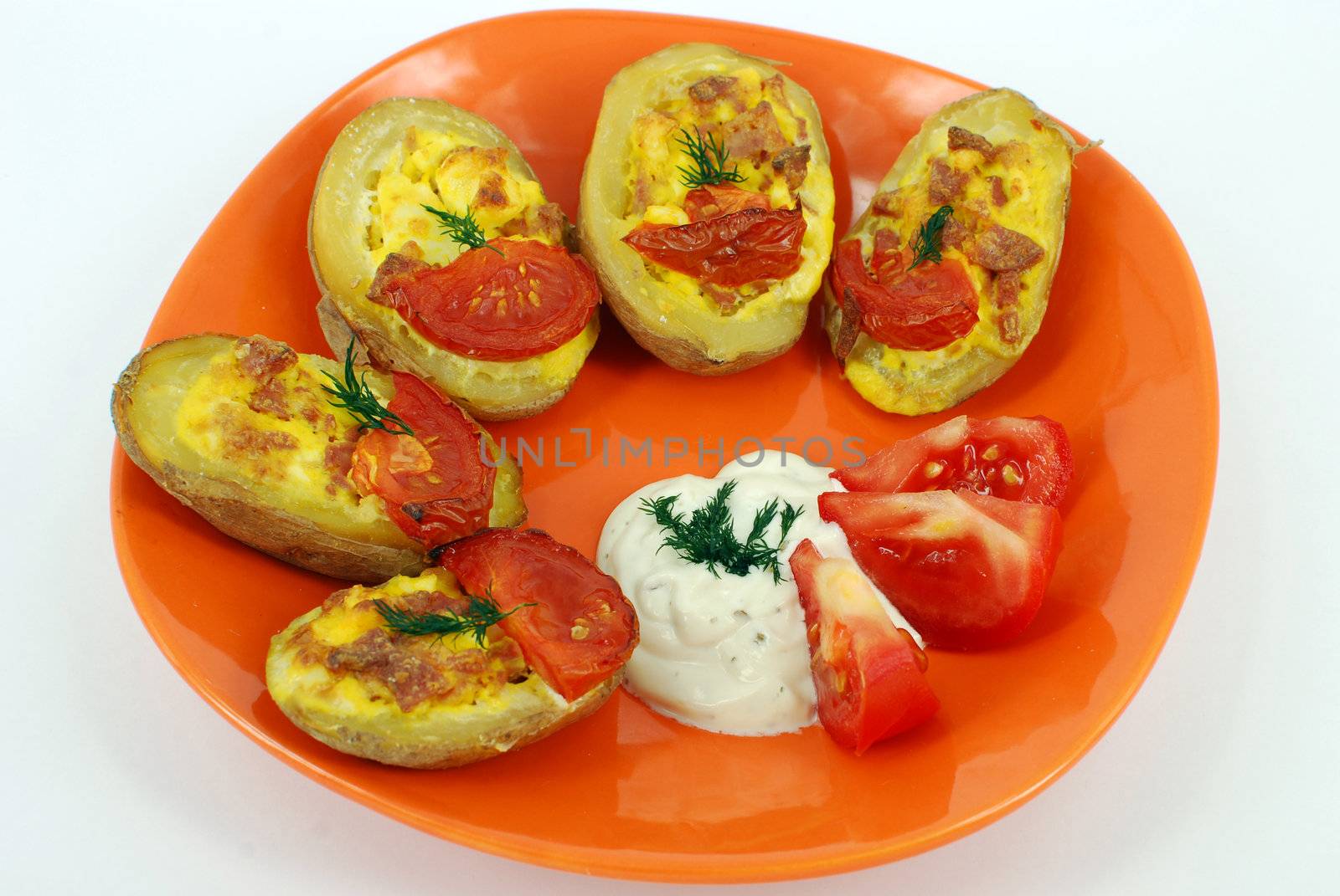 Baked potato filled with eggs sausage and cheese