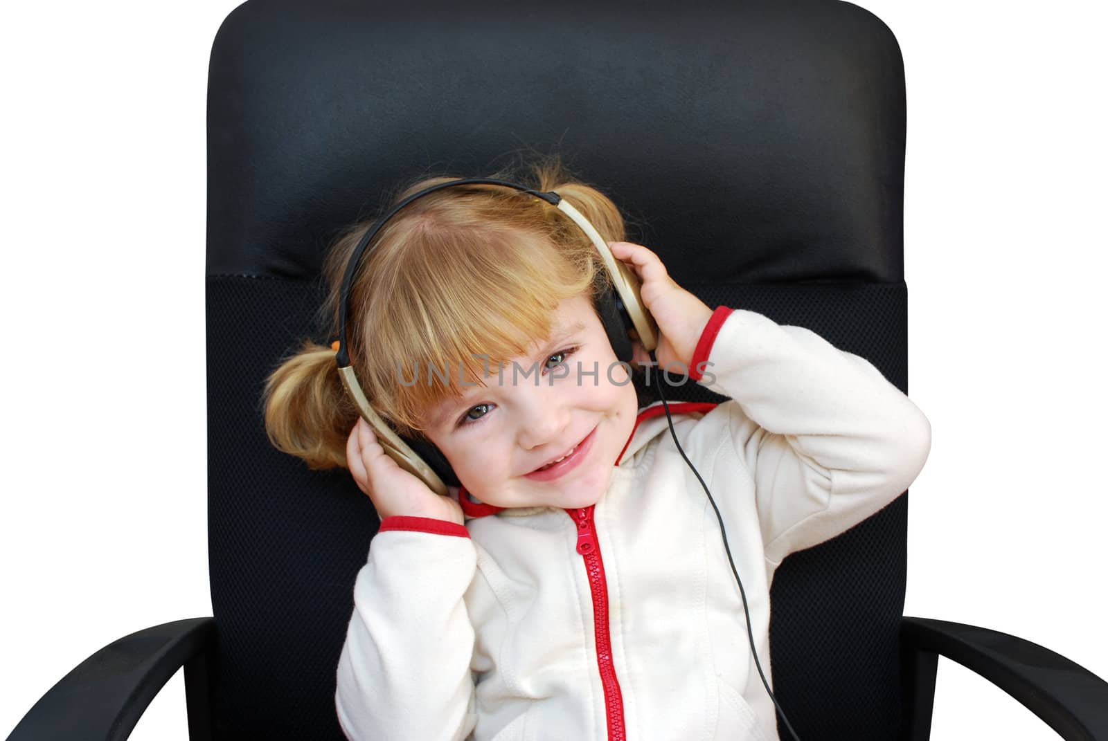 Little girl listen music with headphones