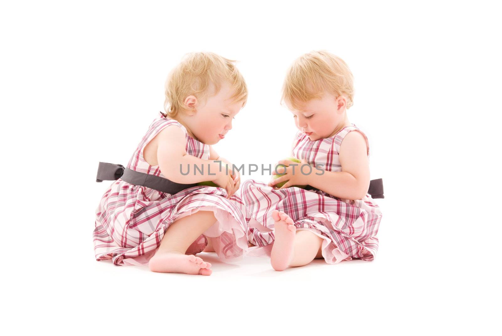 picture of two adorable twins over white