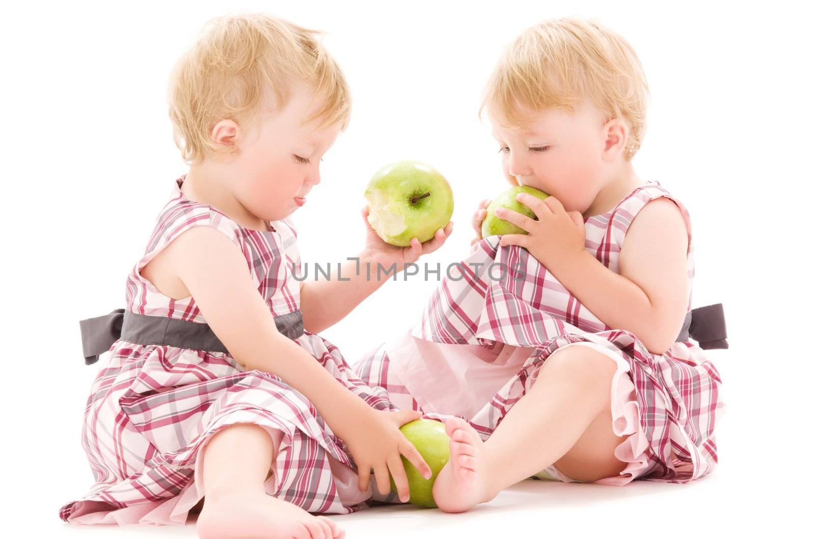 picture of two adorable twins over white