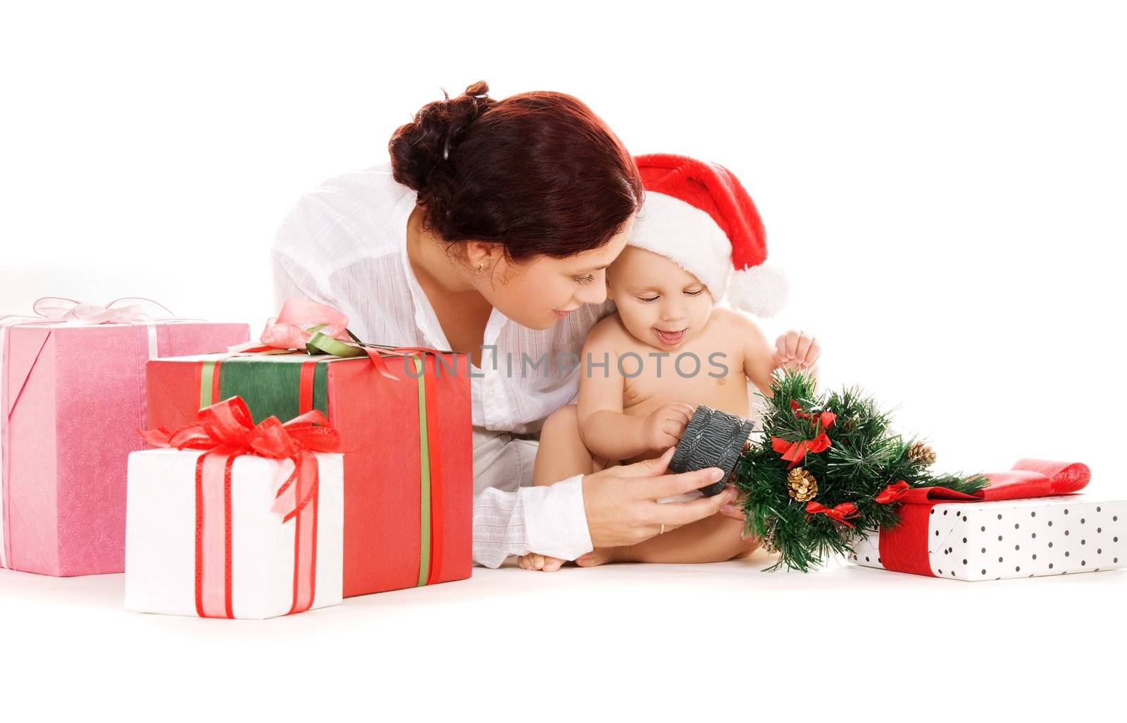baby and mother with christmas gifts over white