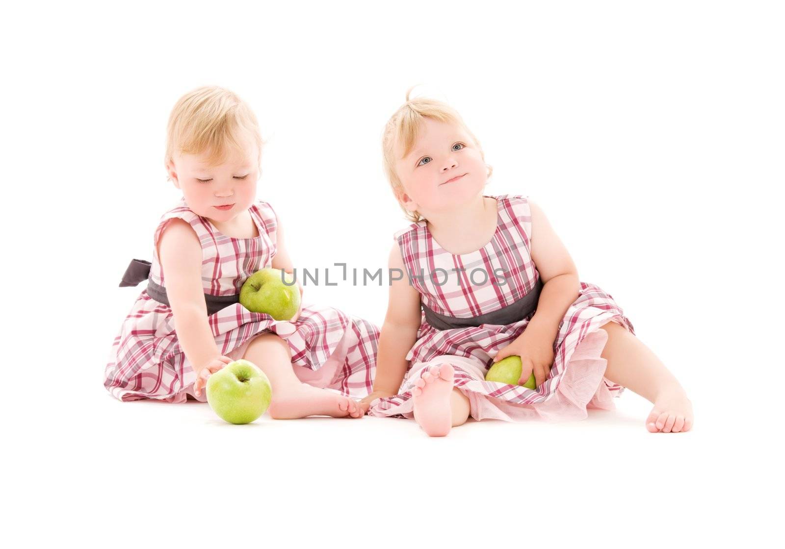 picture of two adorable twins over white