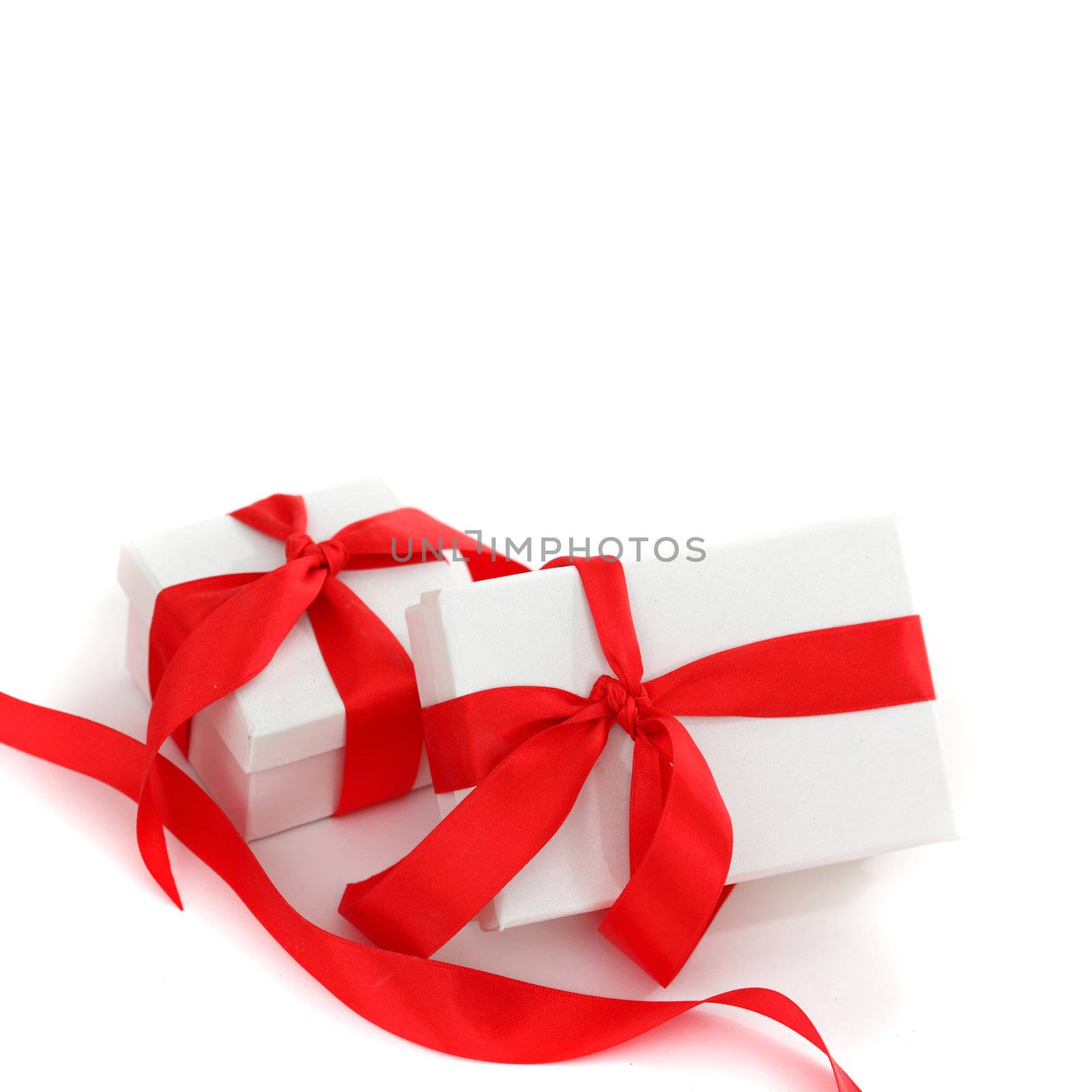 white gift with red ribbon