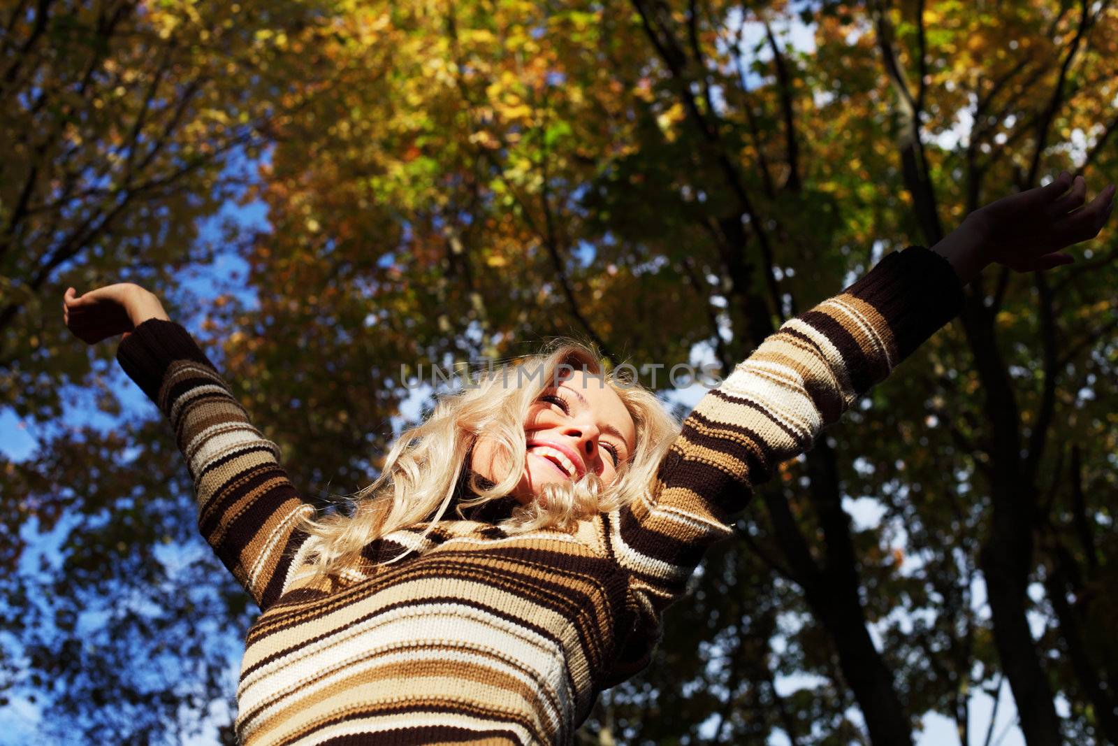 autumn woman hands in the air