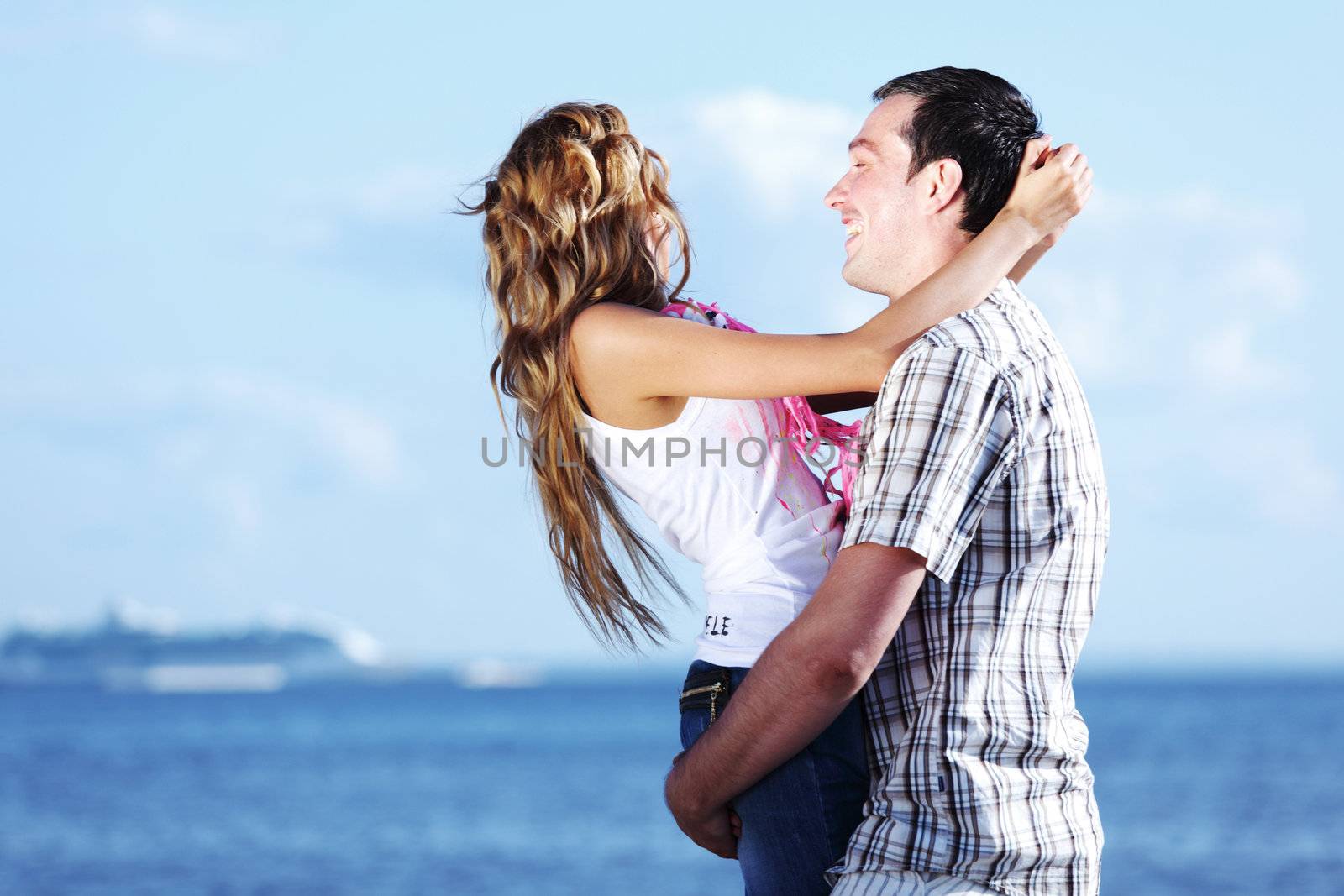 man and woman hug in the sky and sea on sea