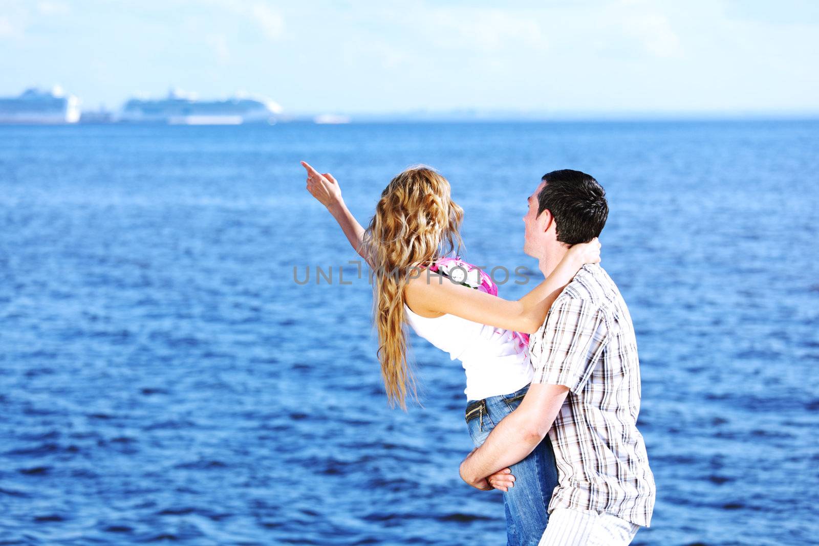 man and woman hug in the sky and sea on sea