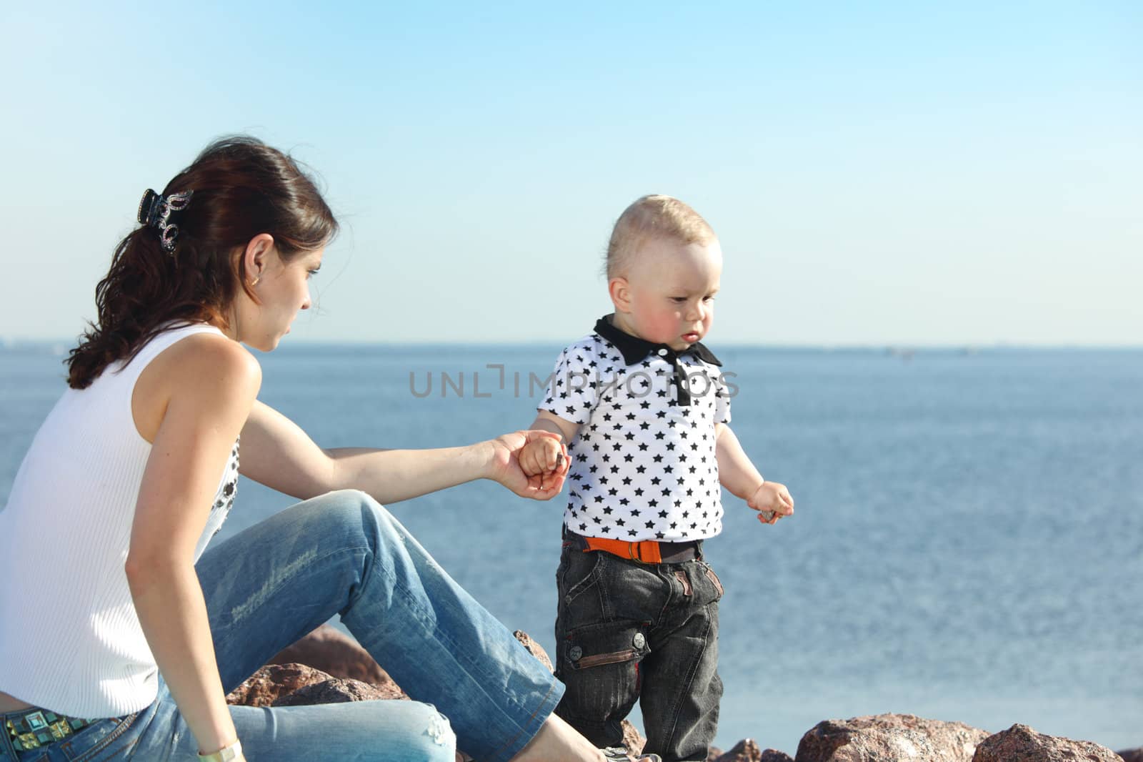 happy mother and son on picnic near sea