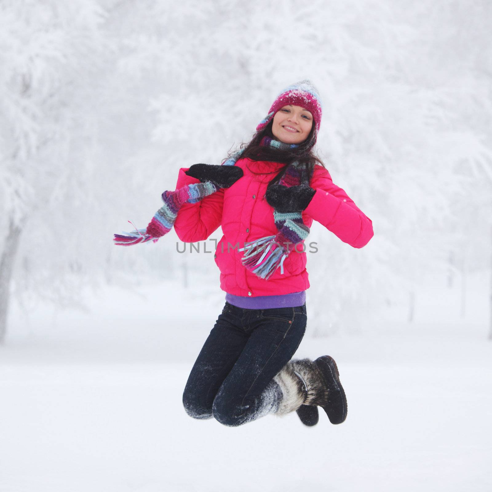 winter women jump in snow