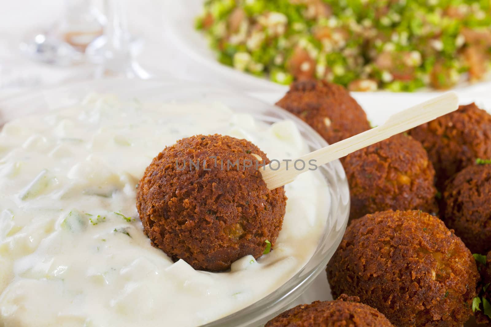 Homemade falafel served with tzatziki and tabbouleh.