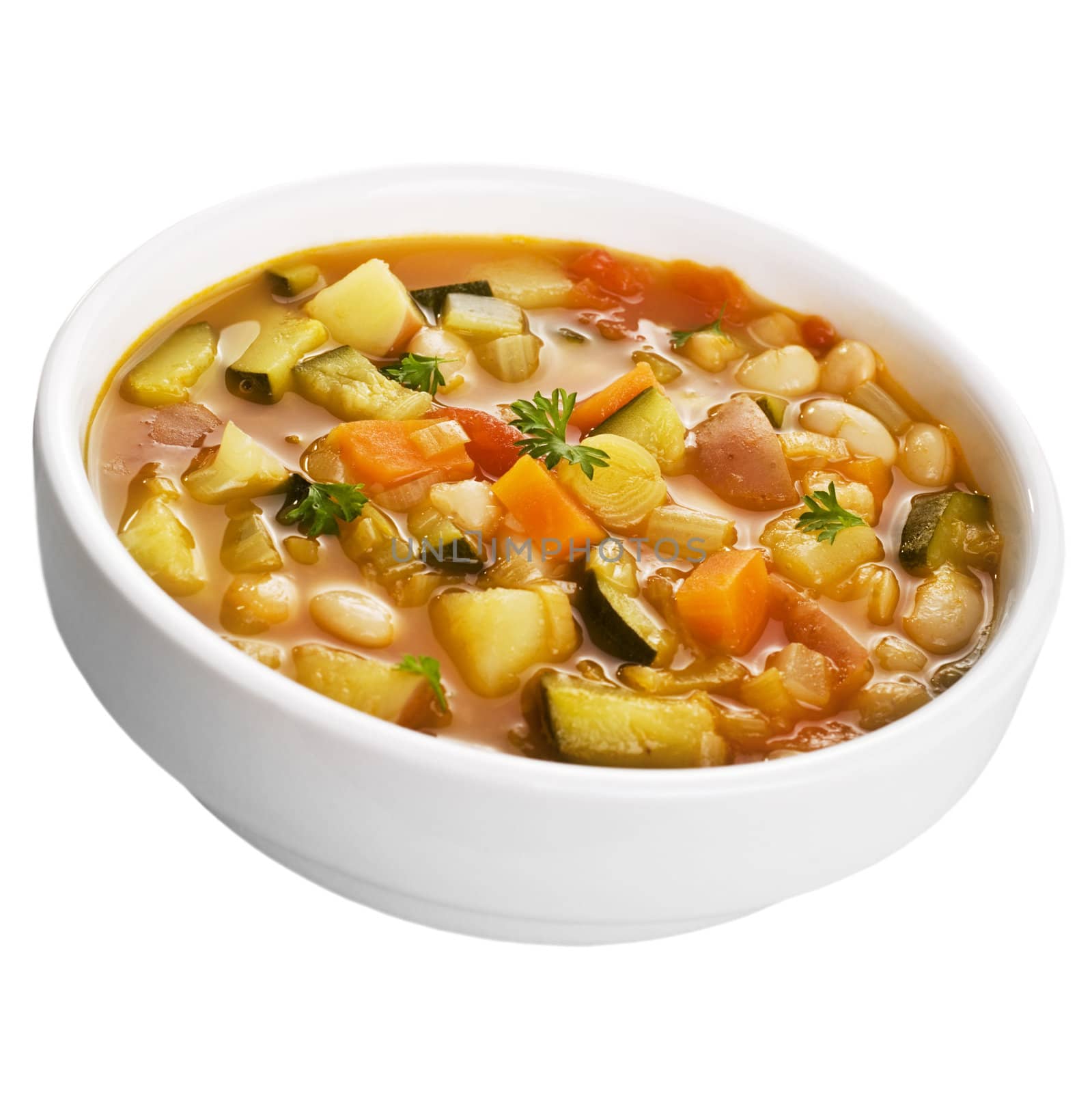 A bowl of vegetable soup isolated on white.
