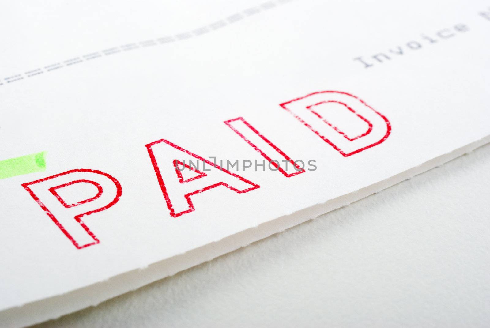 Macro of Paid stamp on invoice, shallow DOF