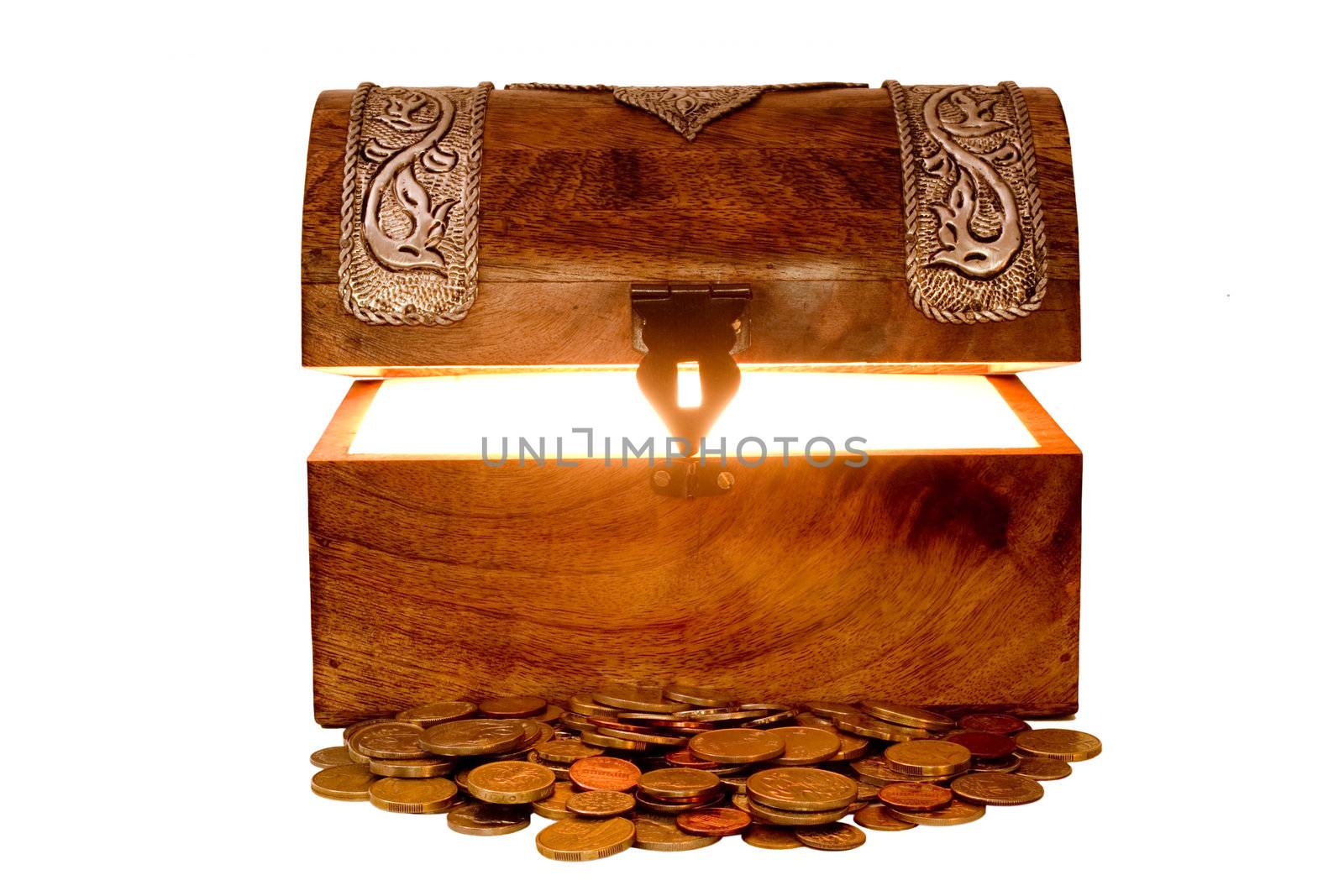 Glowing treasure chest with lid lifted and with a pile of coins in front of it, isolated on white. Coins are a mixture of different currencies, including USA, UK, Australia, New Zealand, Hong Kong, Singapore, but none really stand out.