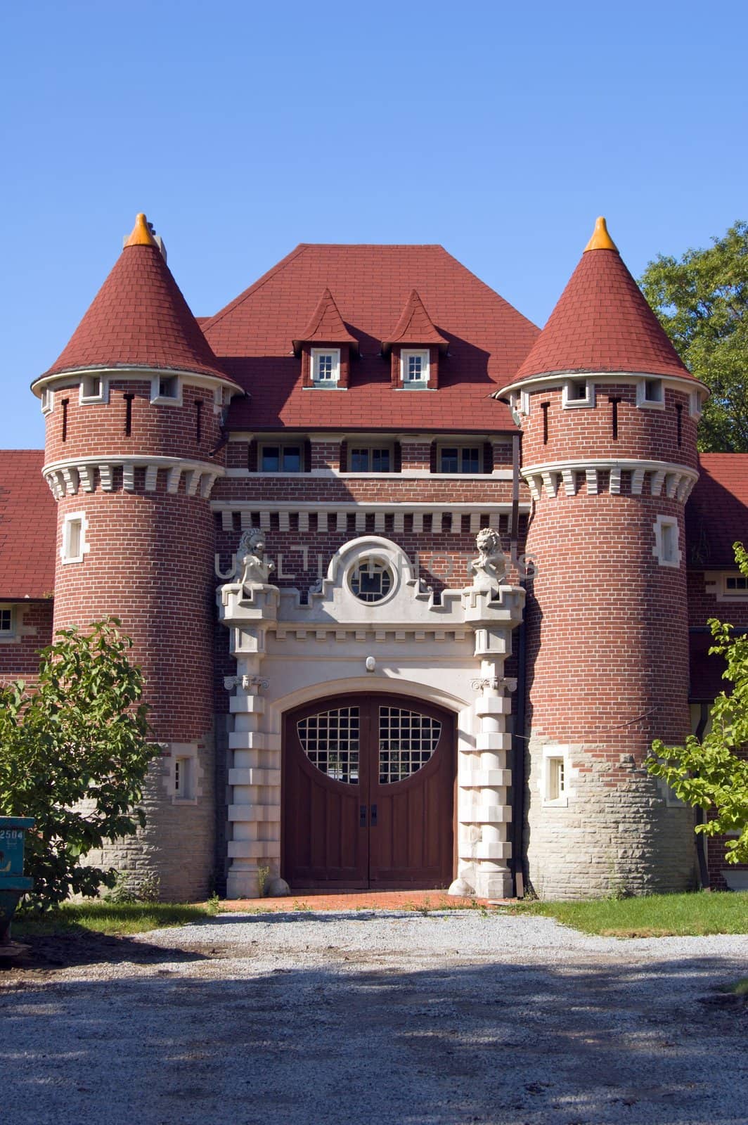 Castle towers and gate on blue sky background
