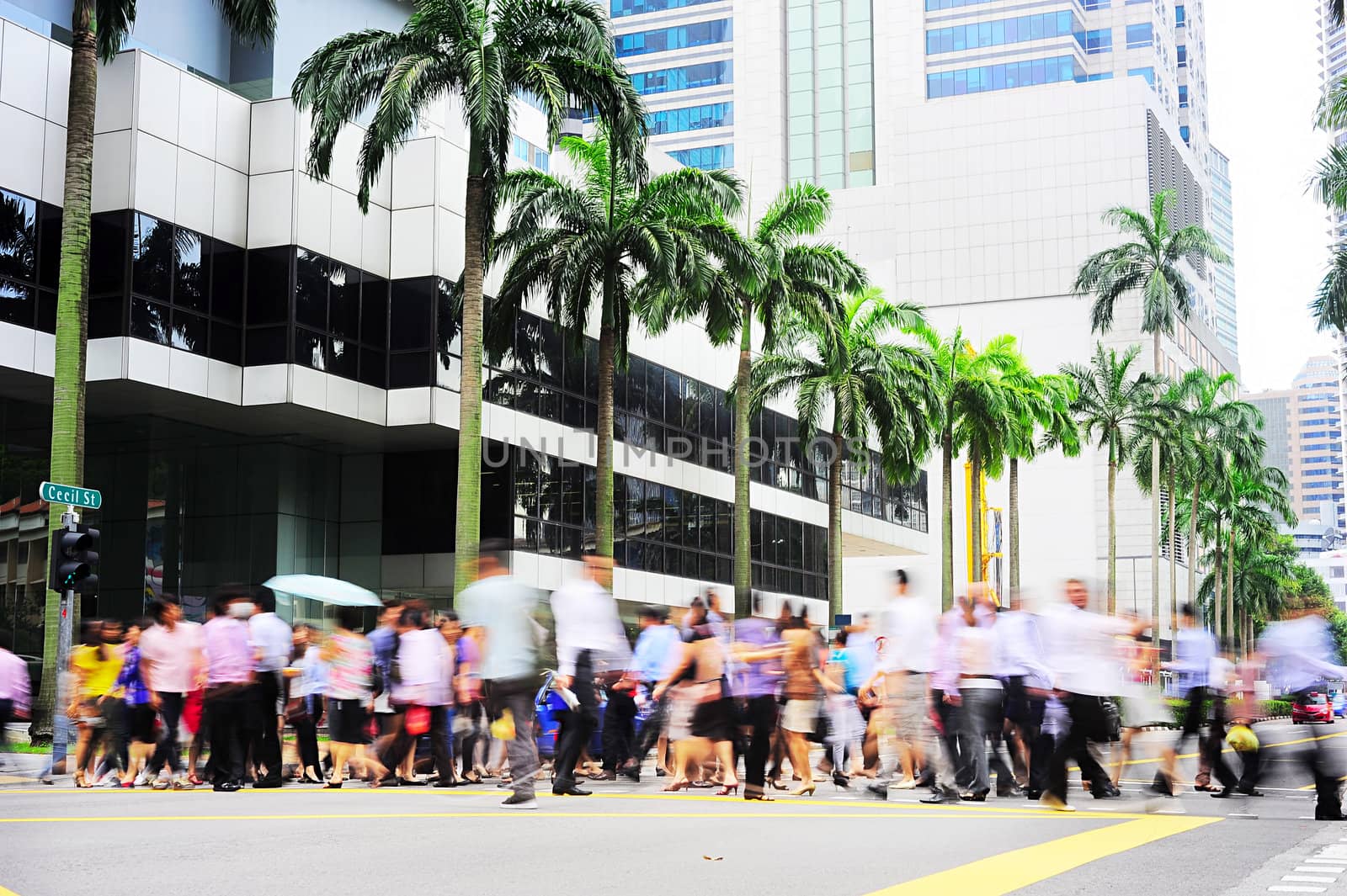 Unidentified businessmen crossing the street in Singapore. There are more than 7,000 multinational corporations from US States, Japan and Europe in Singapore 