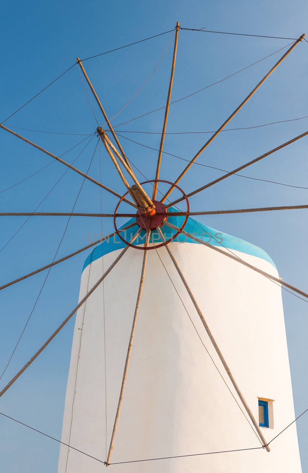 Windmill on Greek island by akarelias
