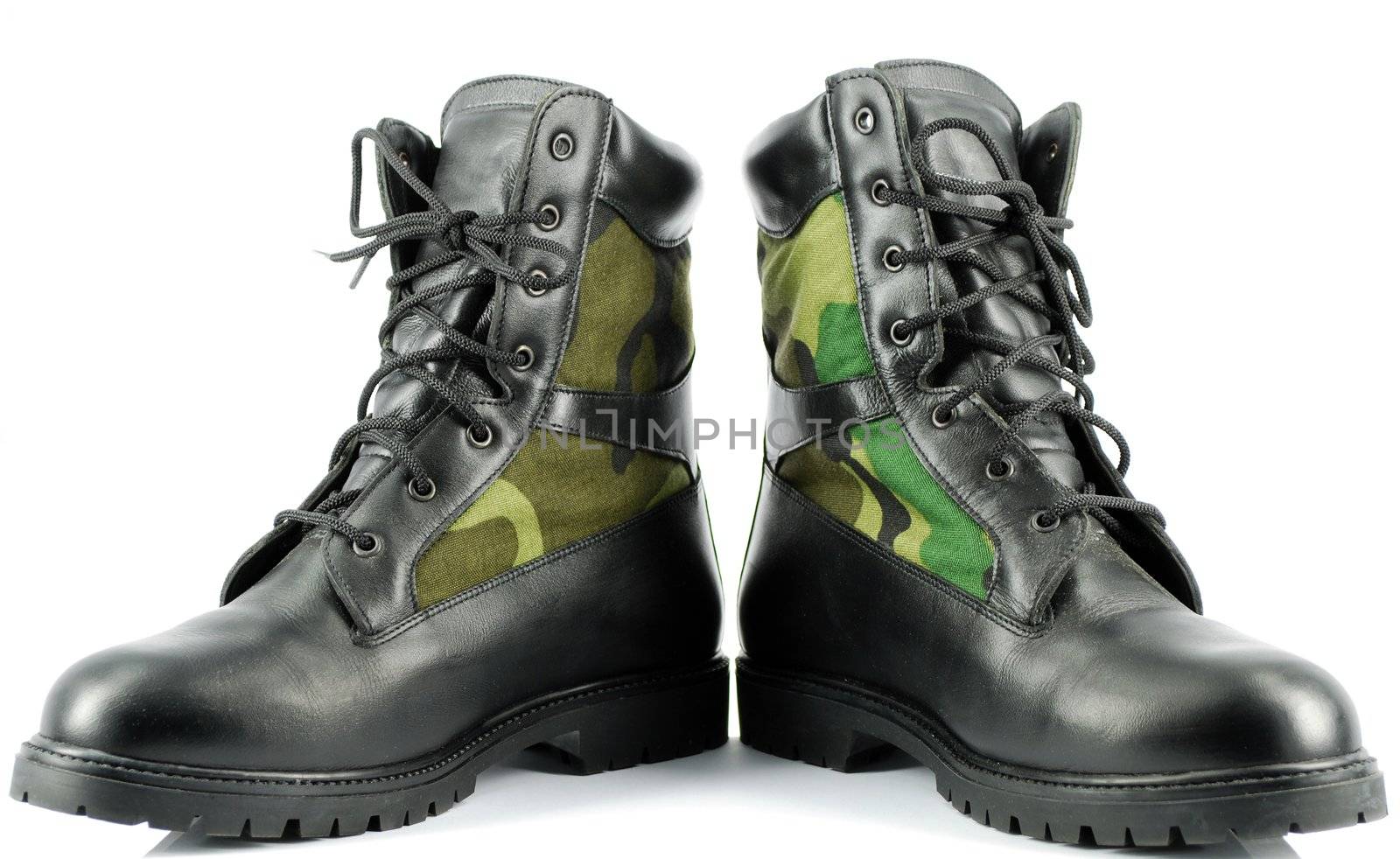 Military combat boots on white