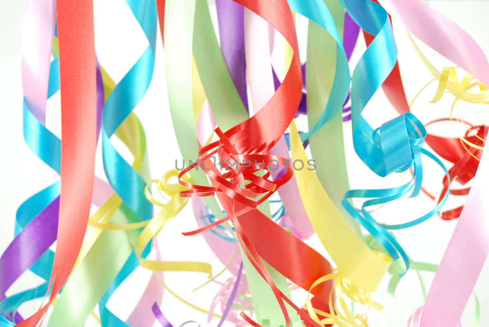 Multicolored ribbons hanging from top