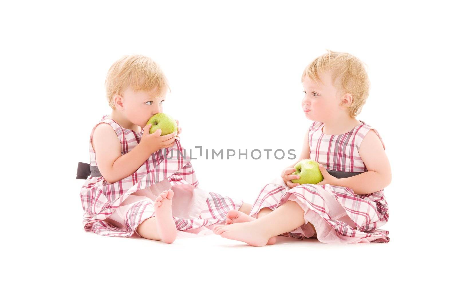 picture of two adorable twins over white