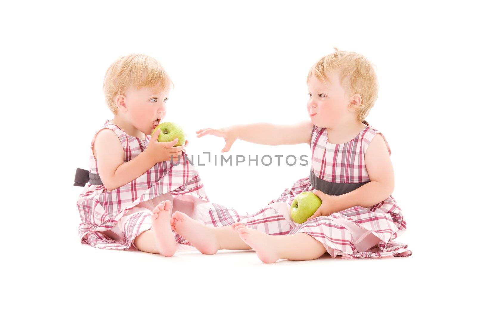 picture of two adorable twins over white