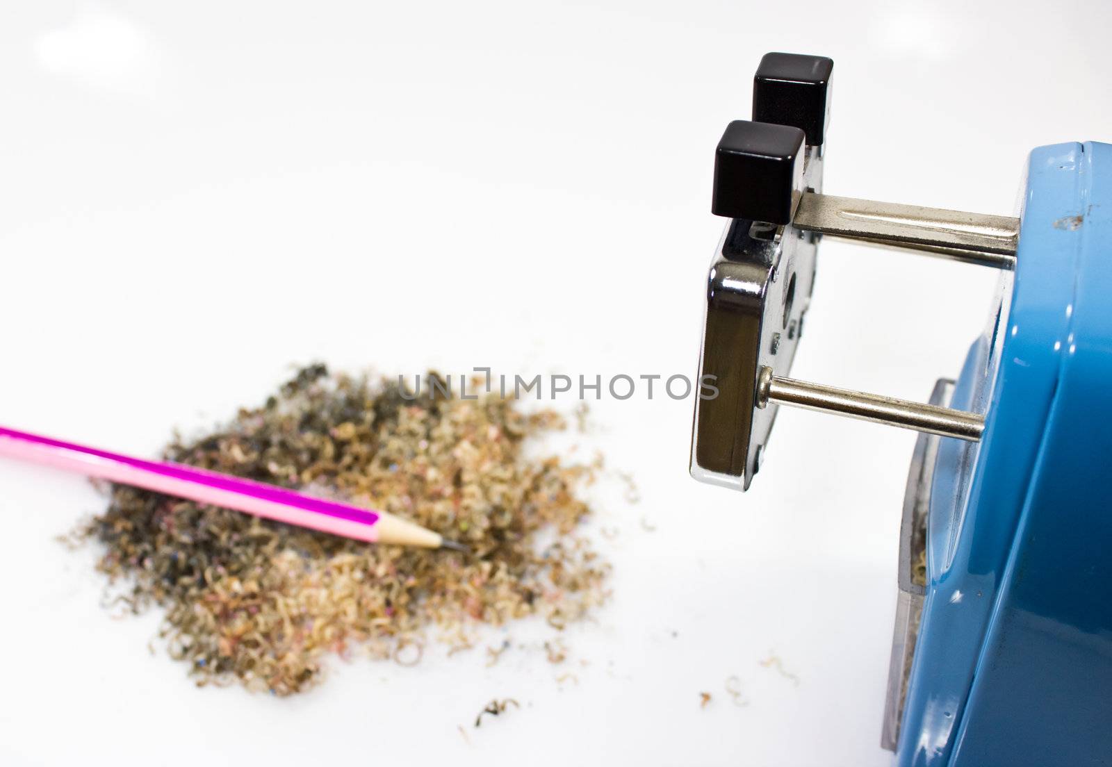 Mechanical sharpener of pencil on the white background