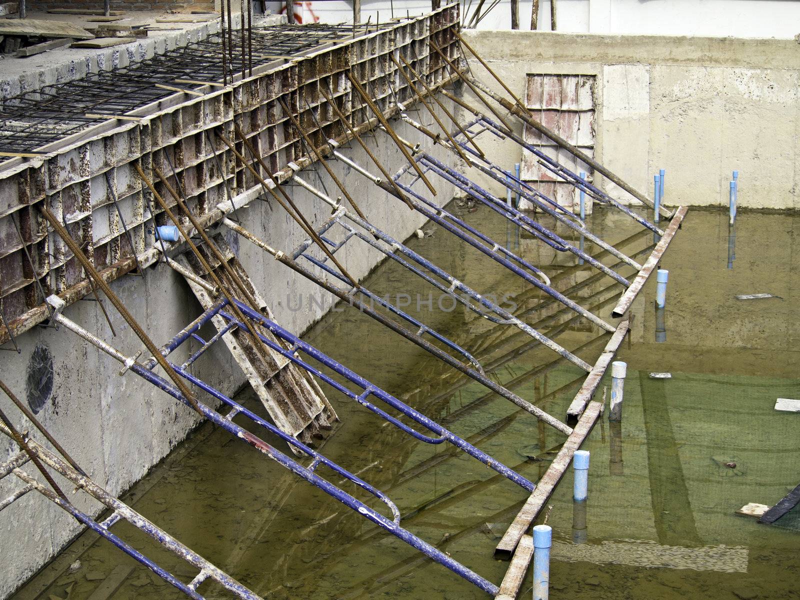 Swimming Pool under construction by siraanamwong