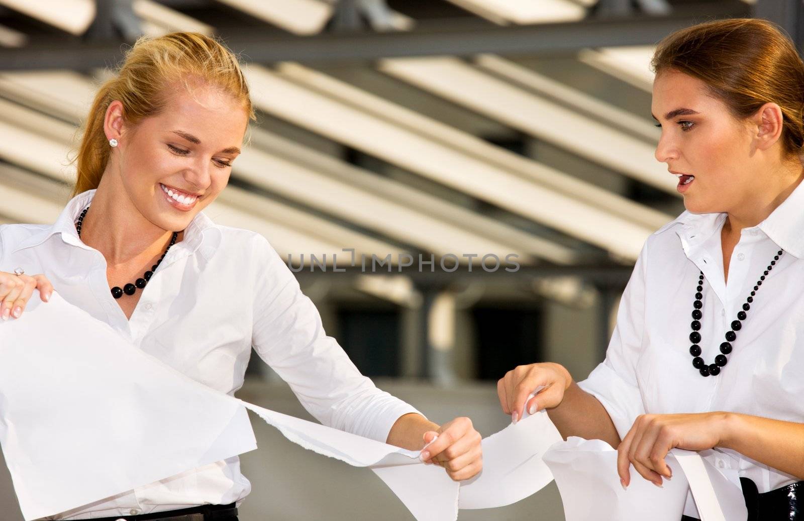bright picture of two angry businesswomen fighting