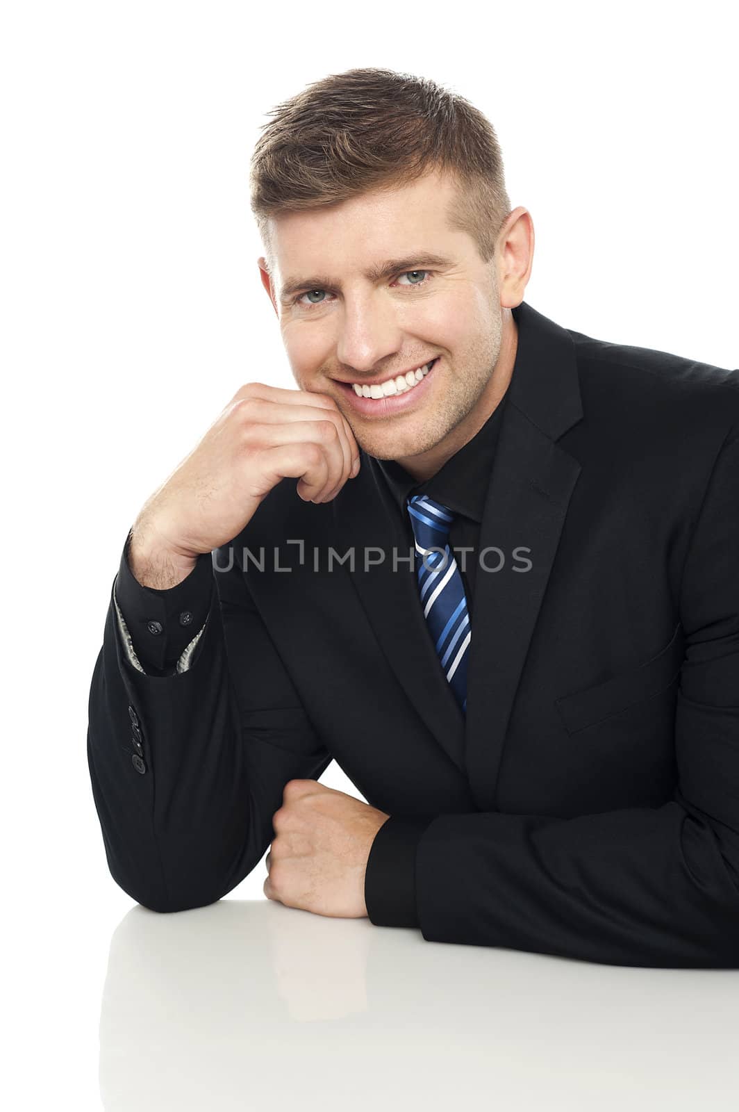 Cheerful corporate executive posing. Isolated on white
