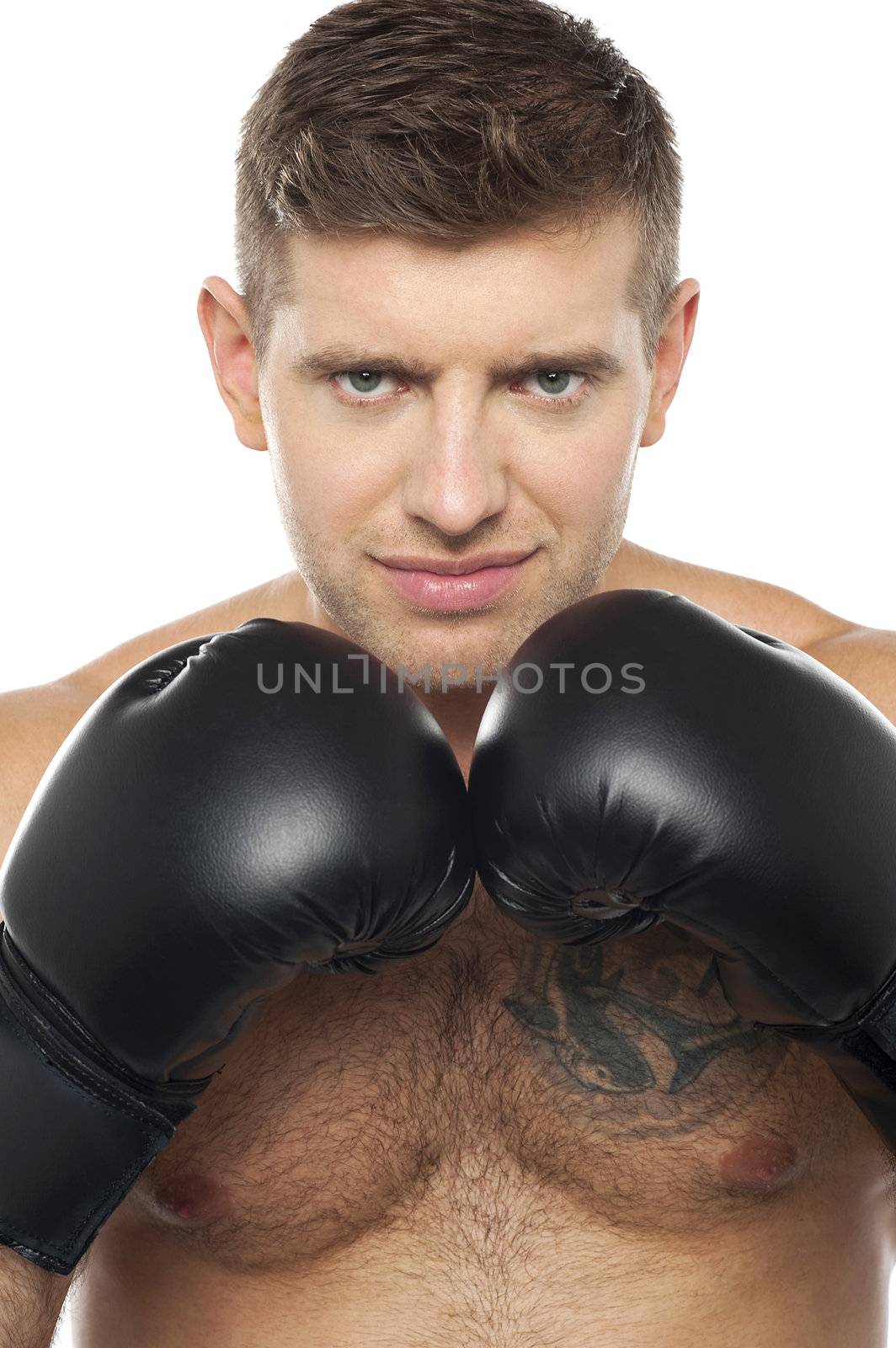 Close up picture of young caucasian boxer with tattoo on his chest