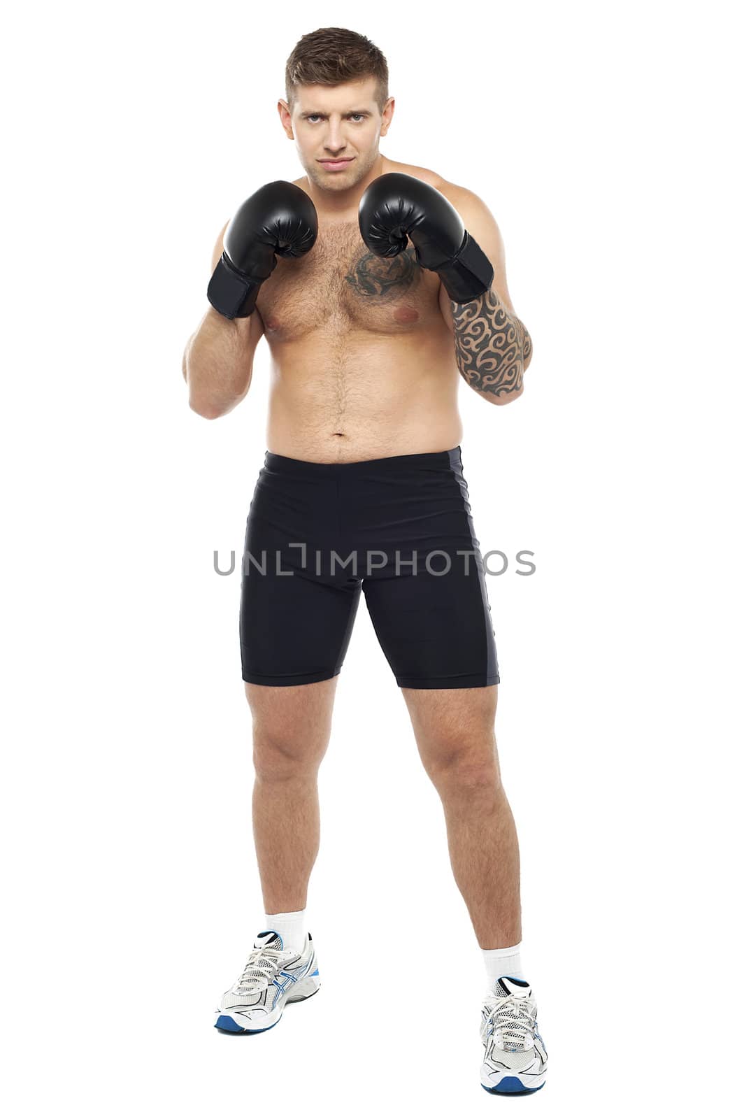 Full length portrait of isolated attractive boxer posing on white background