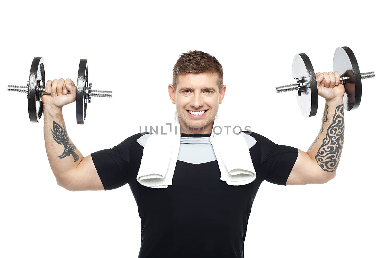 Half length portrait of young bodybuilder exercising. Toning his biceps