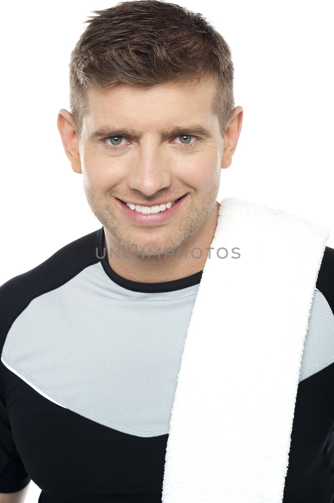 Close up shot of smiling male in sportswear isolated over white