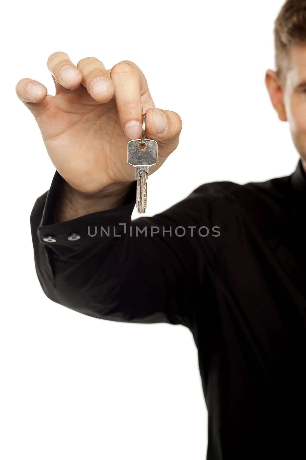 Cropped up of man offering key to you