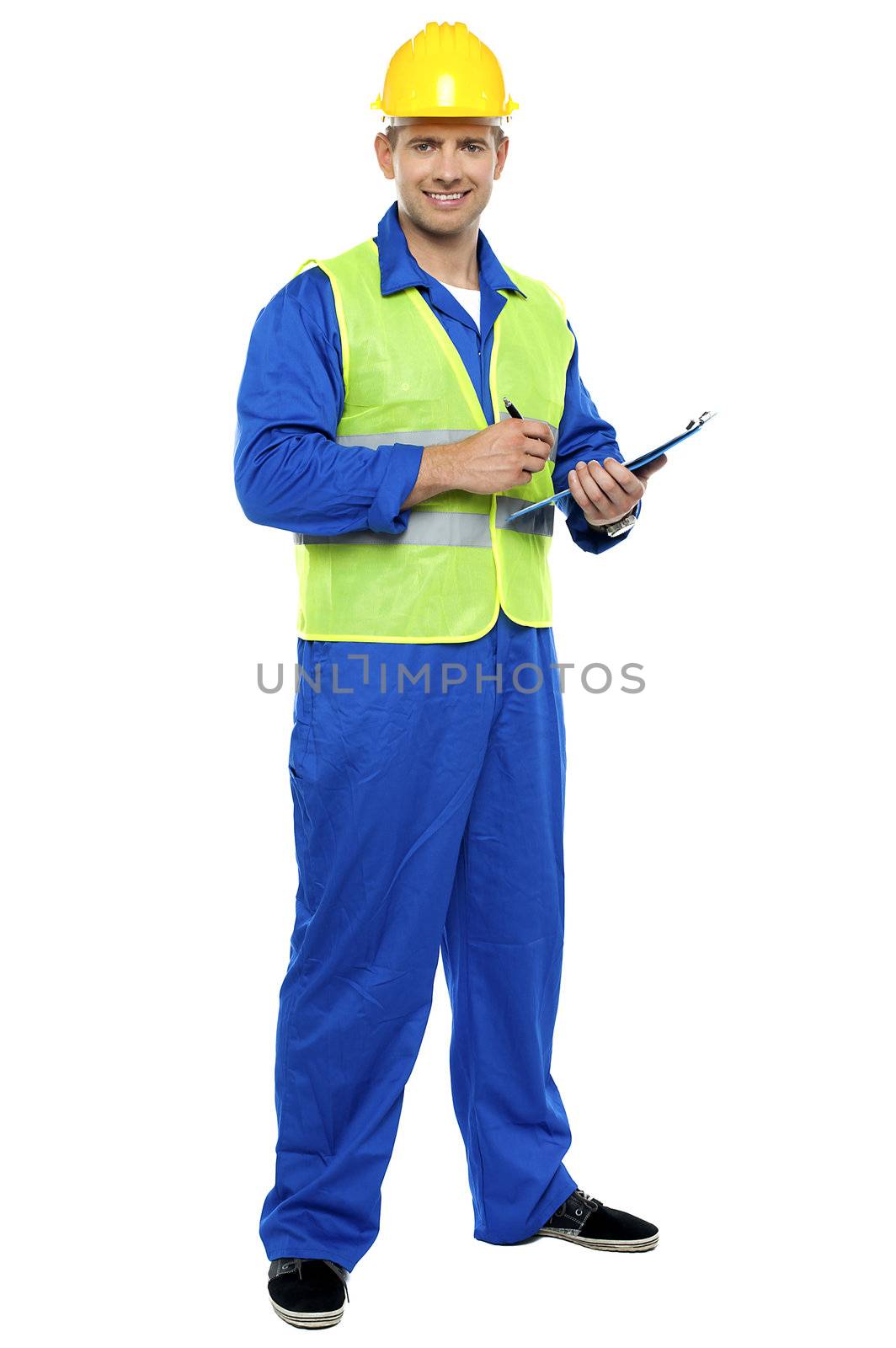 Full length portrait of male architect signing business documents