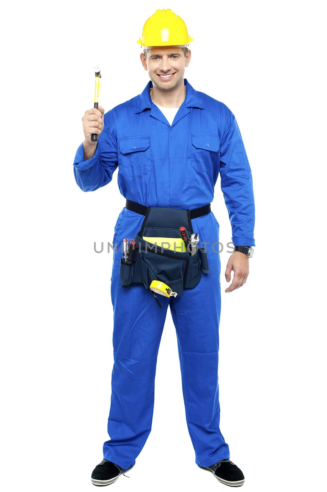 Industrial contractor holding hammer. Full length shot over white background