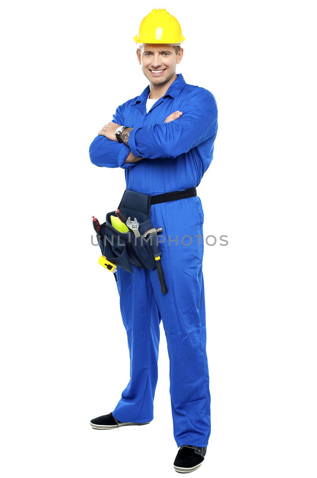 Portrait of confident smart construction worker. Arms folded and posing