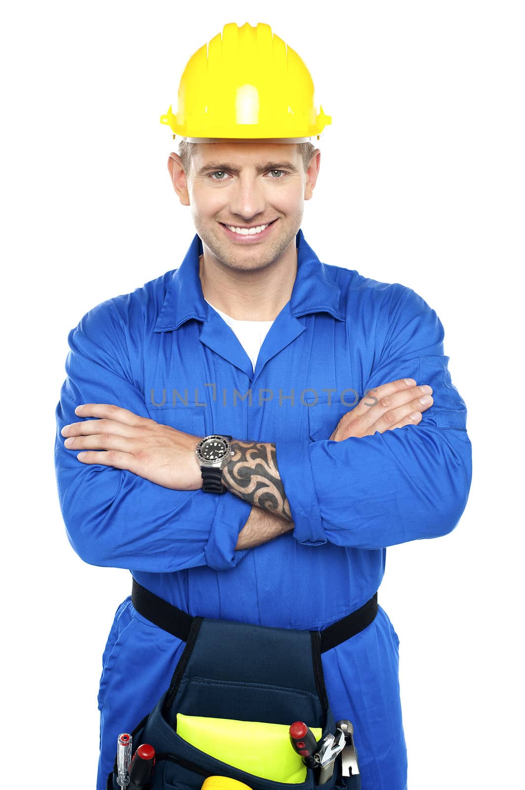 Young repairman in uniform posing with crossed arms isolated over white background