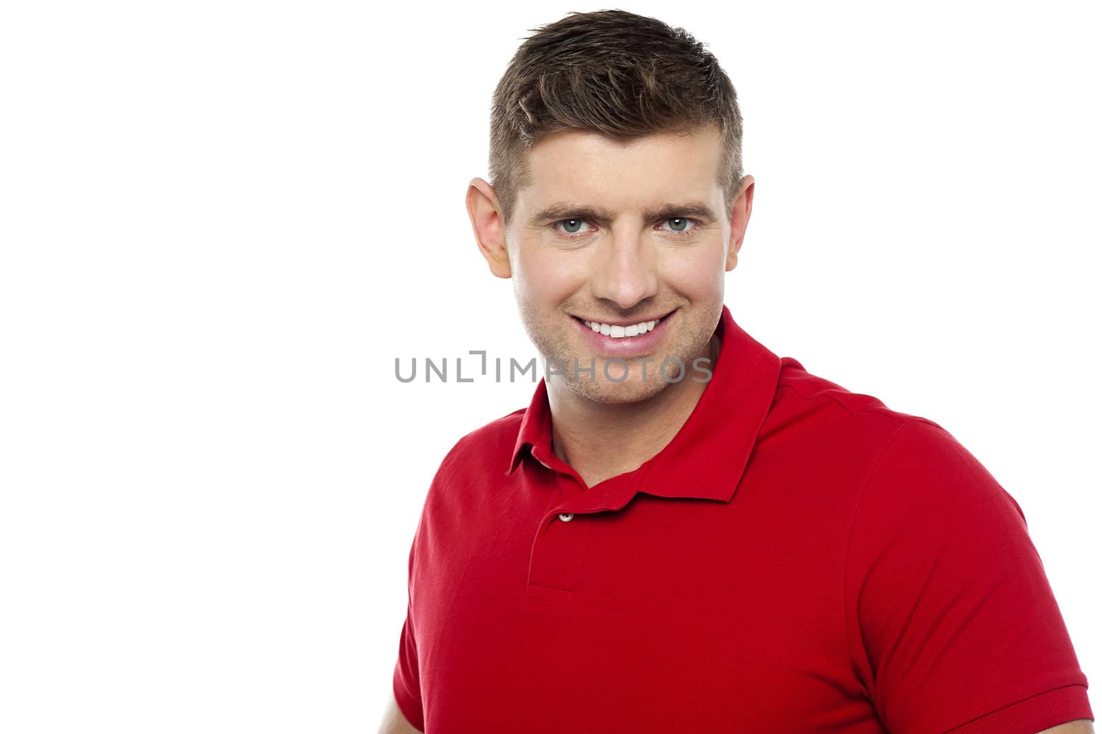 Casual portrait of cheerful young man isolated against white background