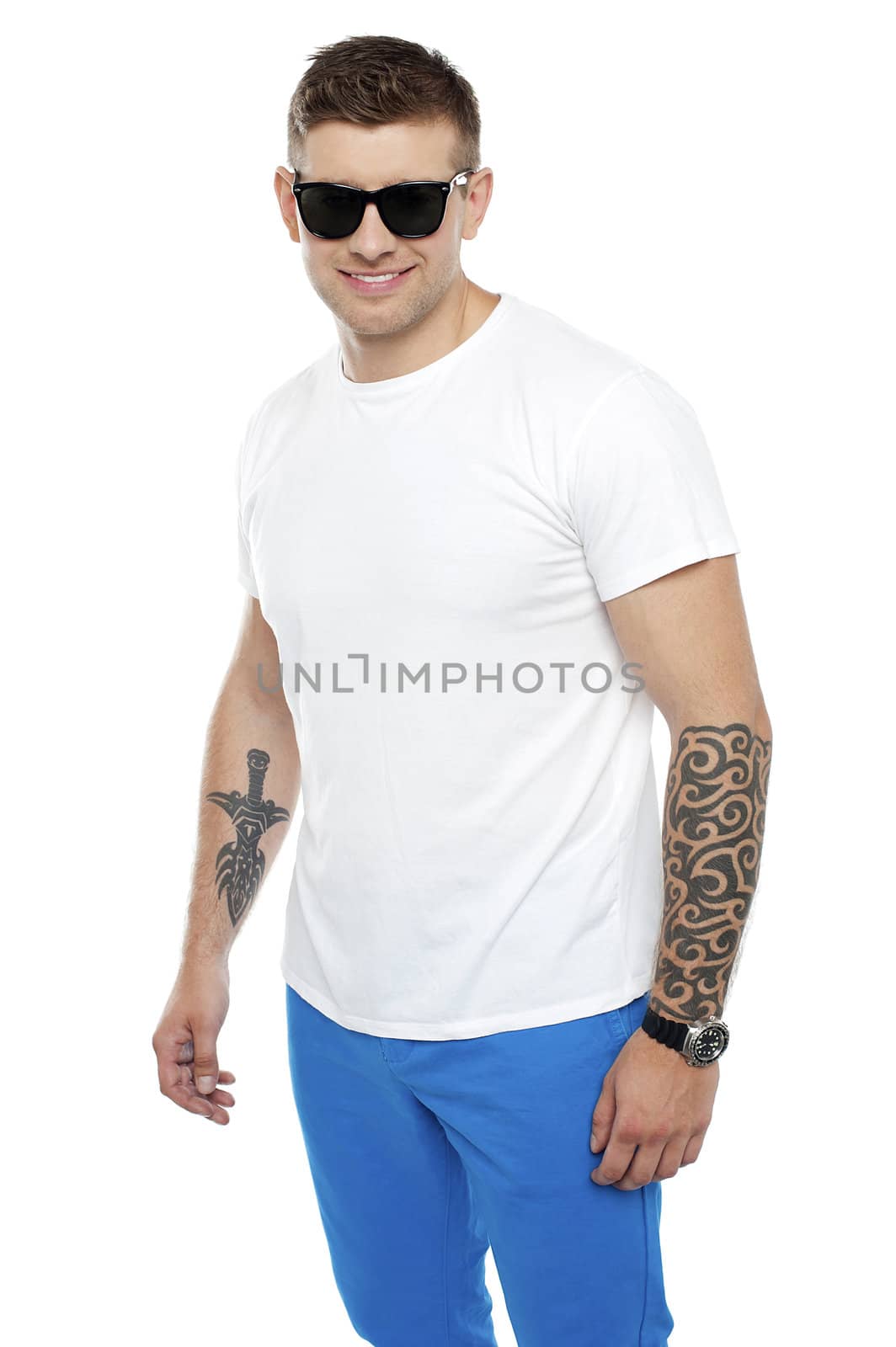 Handsome guy wearing shades and posing over white background