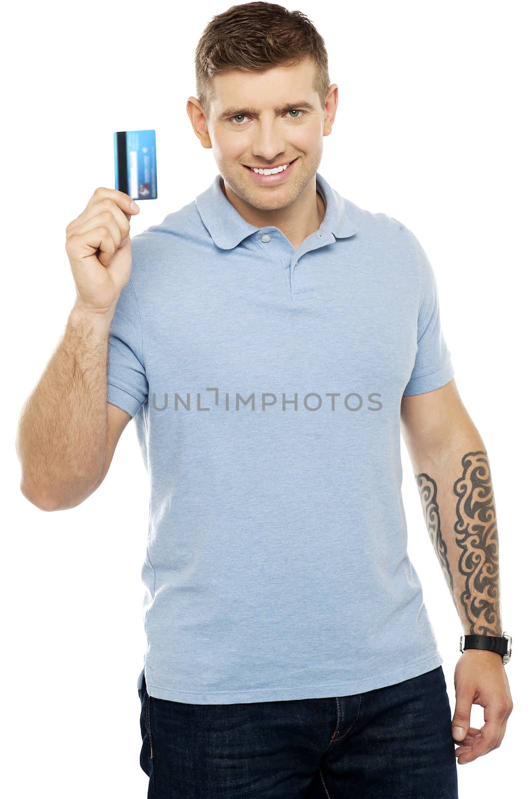 Trendy smart male showing credit card to camera isolated against white background