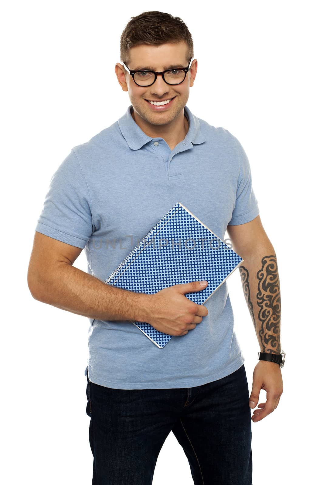 Modern college student holding notebook and posing against white background