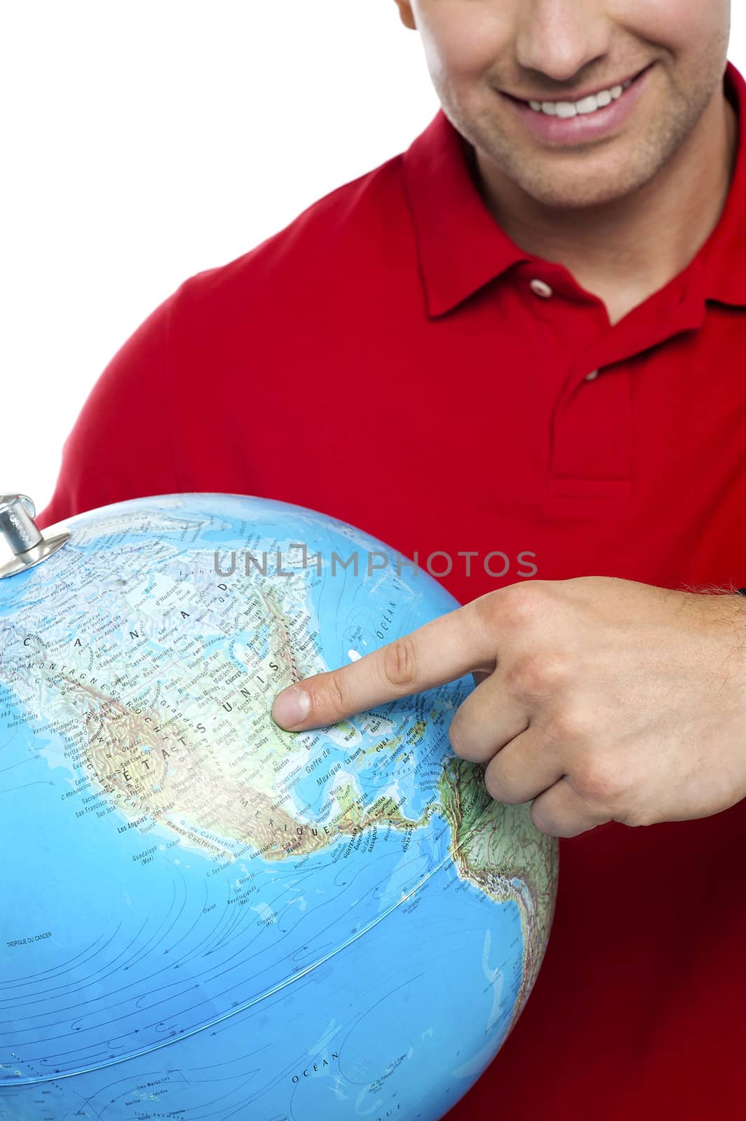 Cropped image smiling man pointing at the globe. Closeup shot